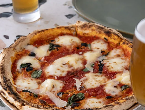 Italian pizza with chicken, onion and paprika